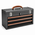 Caja de herramientas de acero negro con asa de cuero y detalles en cobre